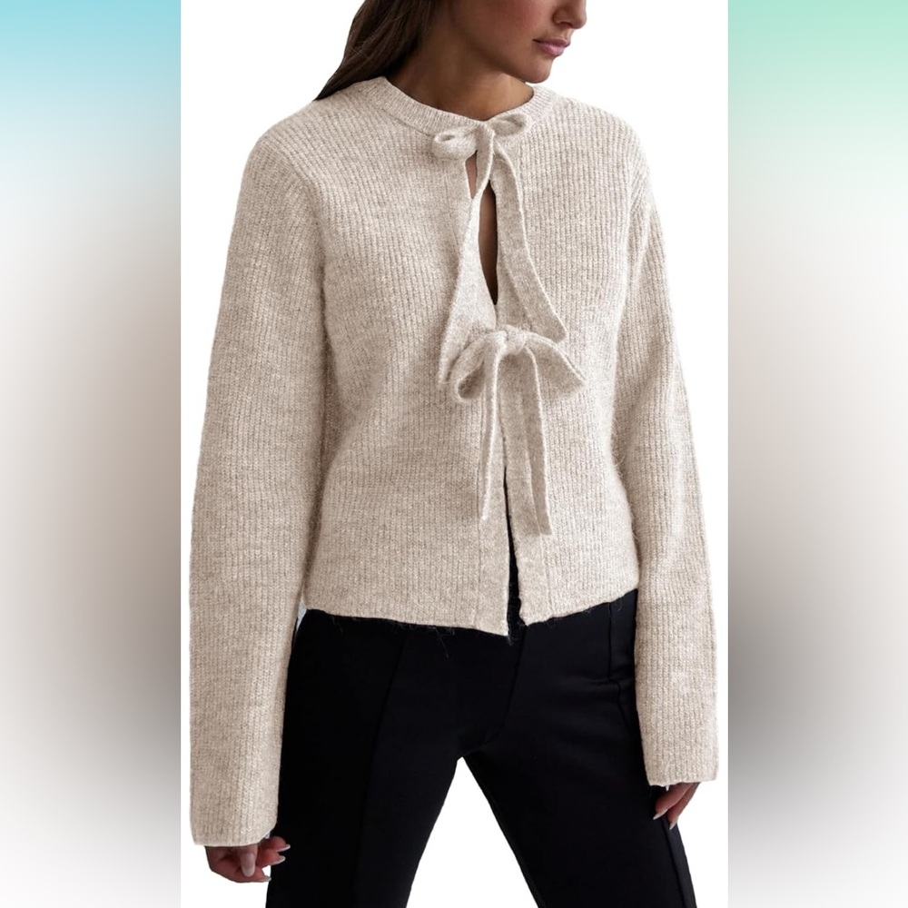 Adorable bow tied sweater. Never worn!